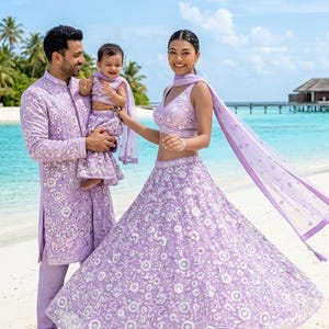 purple lehenga matching groom dress Indian Bride And Groom In A Coordinated Violet Velvet Wedding Lehenga And Sherwani