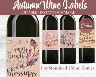 May include: Four printable wine bottle labels with a fall theme. The labels feature a pink background with a watercolor feather design and text that says "Cheers to Family Friends and a Table Full of Blessings", "Sip Savor & Give Thanks", "Gratitude in Every Pour Joy in Every Sip", and "Fall in Love with Good Wine & Great Company".
