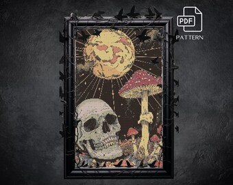May include: A framed cross-stitch pattern featuring a skull, mushrooms, and a full moon. The artwork is in shades of beige, red, and brown, with a black frame and decorative accents. The PDF pattern is available.