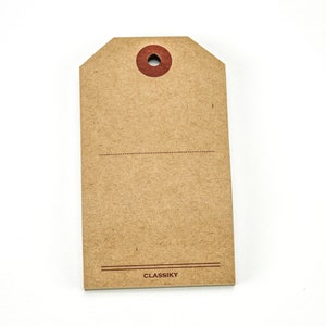 May include: A brown paper gift tag with a red circle and a hole in the center. The tag has a dotted line and the word "CLASSIKY" printed at the bottom.