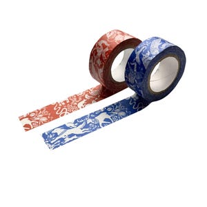 May include: Two rolls of decorative washi tape. One roll is red with a white pattern, and the other is blue with a white pattern. The patterns feature various animal and floral designs. The tape is unspooled, showing the patterned adhesive.