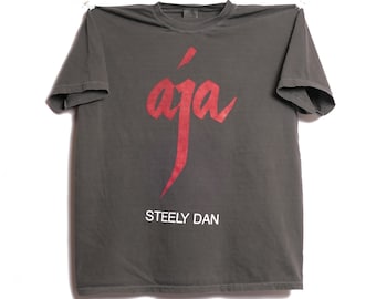100★puppilyhils オロク 06 Bit Fringe Tee Steely Dan Aja Tee Classic Rock Album Donald Fagen Peg Deacon