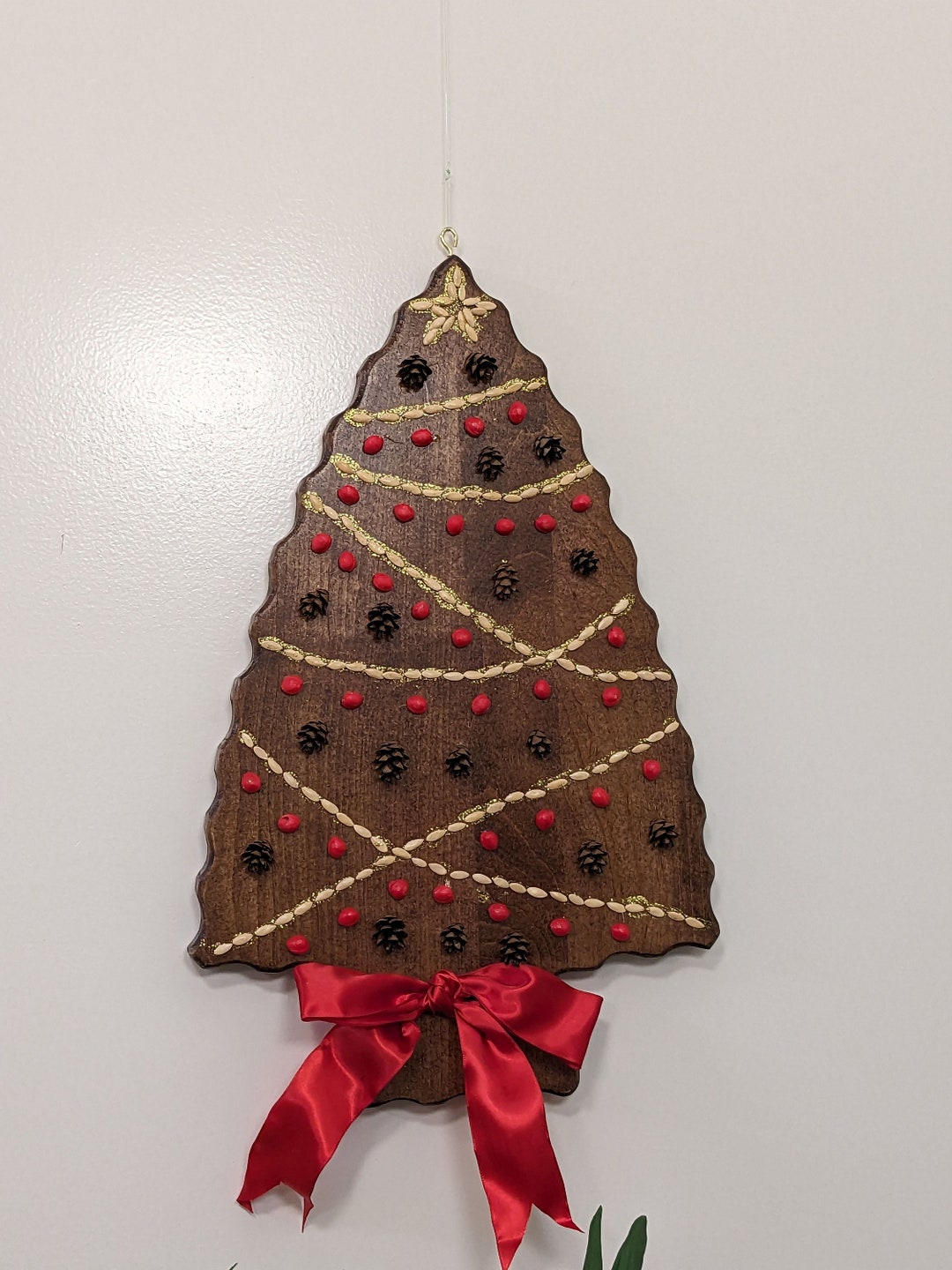 Wooden Christmas Tree Wall Decor. Decorated With Seeds and Hemlock Cones and Glitter. Dark