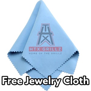May include: A light blue microfiber jewelry cleaning cloth with the text "HTX GRILLZ HOME OF THE GRILLZ" and a stylized oil rig logo.