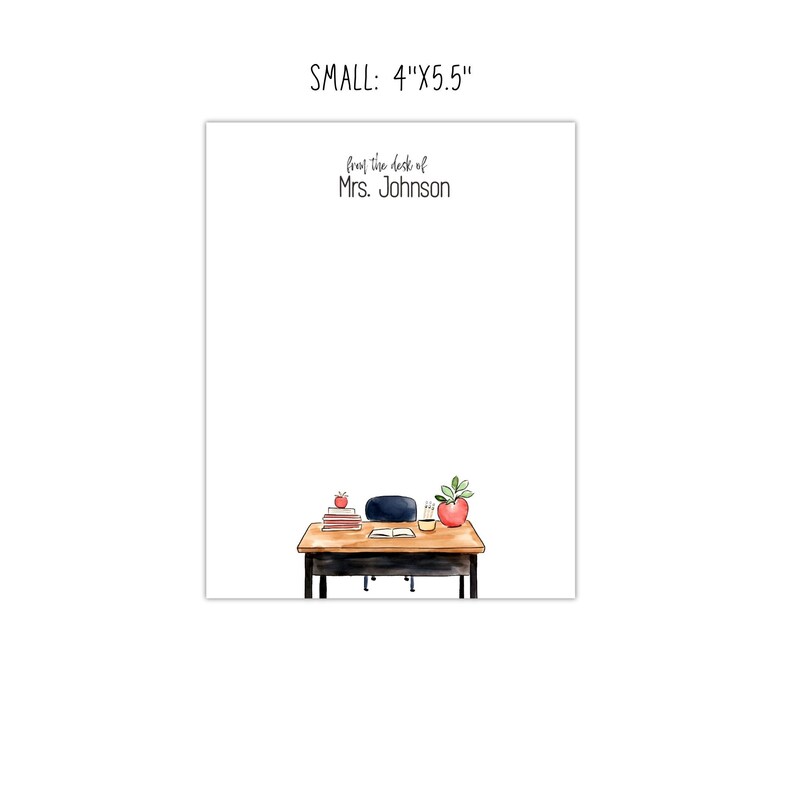 May include: A white notepad with the text "from the desk of Mrs. Johnson" at the top. The bottom of the notepad features a watercolor illustration of a desk with books, an apple, a plant, and a chair. The notepad measures 4" x 5.5".