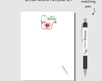 May include: A white notepad with a red stethoscope and heart with a heartbeat line graphic and the text "Nurse Brittany". A black pen with the same graphic and text is included.