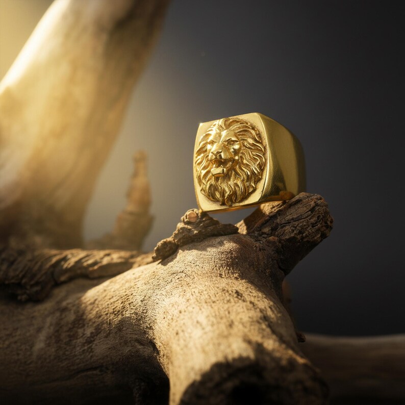 African lion ring, safari inspired lion jewelry, symbolic king of the jungle statement band, and handcrafted bold accessory designed for those who are drawn to strength, courage, and untamed masculine energy. This striking ring features a detailed African lion head motif with textured mane engravings and powerful facial details, creating a commanding appearance inspired by wildlife symbolism, tribal aesthetics, and fearless leadership.