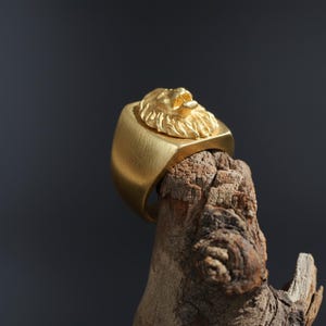 African lion ring, safari inspired lion jewelry, symbolic king of the jungle statement band, and handcrafted bold accessory designed for those who are drawn to strength, courage, and untamed masculine energy. This striking ring features a detailed African lion head motif with textured mane engravings and powerful facial details, creating a commanding appearance inspired by wildlife symbolism, tribal aesthetics, and fearless leadership.