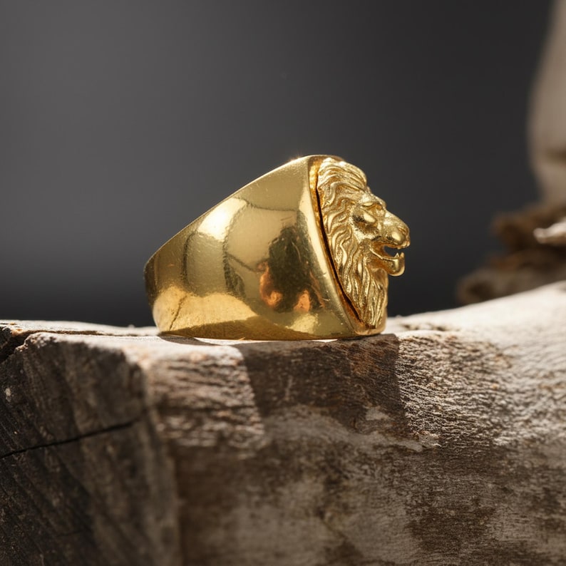 African lion ring, safari inspired lion jewelry, symbolic king of the jungle statement band, and handcrafted bold accessory designed for those who are drawn to strength, courage, and untamed masculine energy. This striking ring features a detailed African lion head motif with textured mane engravings and powerful facial details, creating a commanding appearance inspired by wildlife symbolism, tribal aesthetics, and fearless leadership.