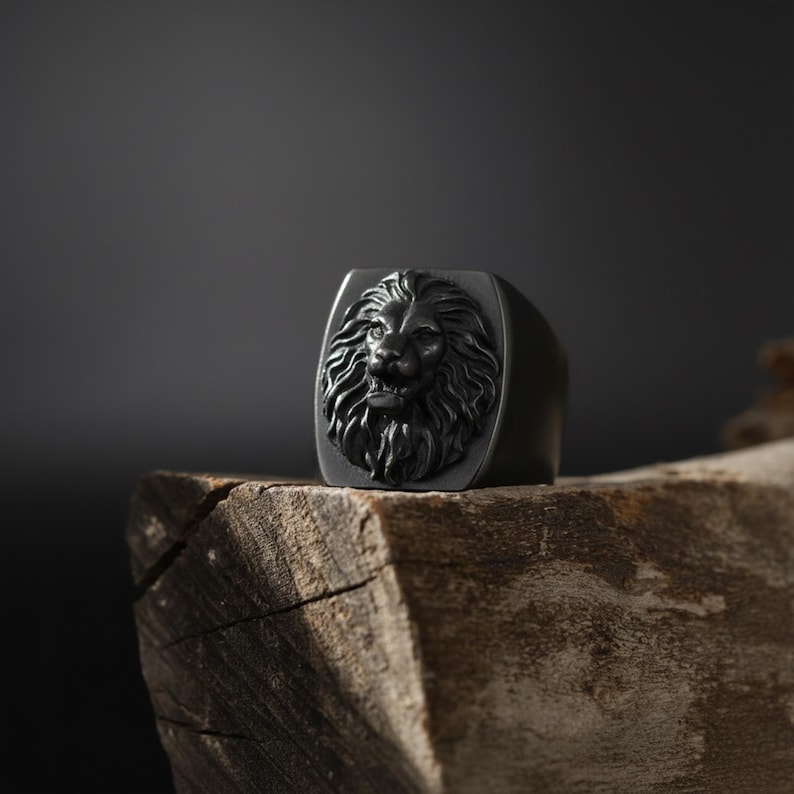 African lion ring, safari inspired lion jewelry, symbolic king of the jungle statement band, and handcrafted bold accessory designed for those who are drawn to strength, courage, and untamed masculine energy. This striking ring features a detailed African lion head motif with textured mane engravings and powerful facial details, creating a commanding appearance inspired by wildlife symbolism, tribal aesthetics, and fearless leadership.