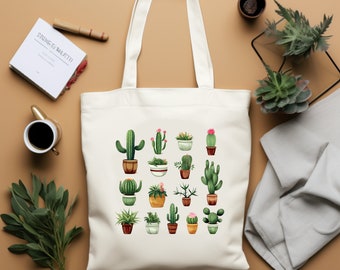 May include: White canvas tote bag with a design of various potted cacti in green, brown, and pink. The cacti are arranged in a grid pattern.