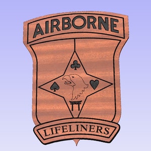 May include: A wooden plaque with a black outline and the words "AIRBORNE" and "LIFELINERS" in black lettering. The plaque features a stylized eagle with a star and playing card symbols.