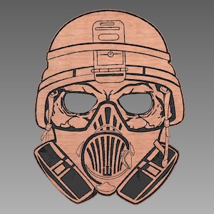 May include: A brown wooden mask with a black gas mask design. The mask has a skull-like face with eye holes and a helmet on top.