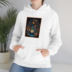 May include: White hoodie with a graphic print of a lighthouse surrounded by trees and stars. The lighthouse is lit up with orange light.