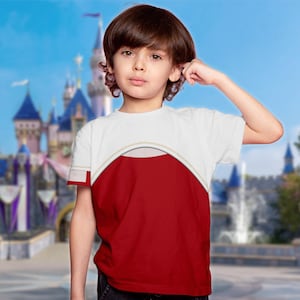 May include: A white and red t-shirt with a curved design across the chest. The shirt has a white upper section and a red lower section. The background features a blurred image of a castle.