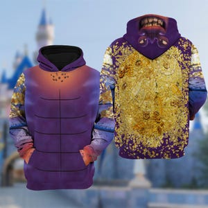 Puede incluir: Dos sudaderas con capucha con dise&ntilde;os &uacute;nicos. Una presenta un torso morado con una secci&oacute;n superior naranja y dorada degradada, y la otra muestra un patr&oacute;n dorado y morado con una cara en la capucha. Ambas tienen bolsillos delanteros.