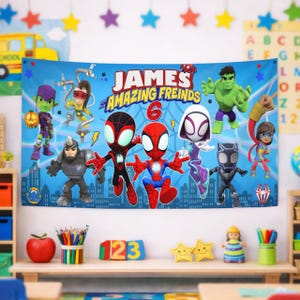 May include: A rectangular blue fabric banner featuring the text "JAMES and his AMAZING FREINDS" with a large red number 6. The design includes cartoon illustrations of various superheroes, including Spider-Man, Ghost-Spider, and the Hulk.