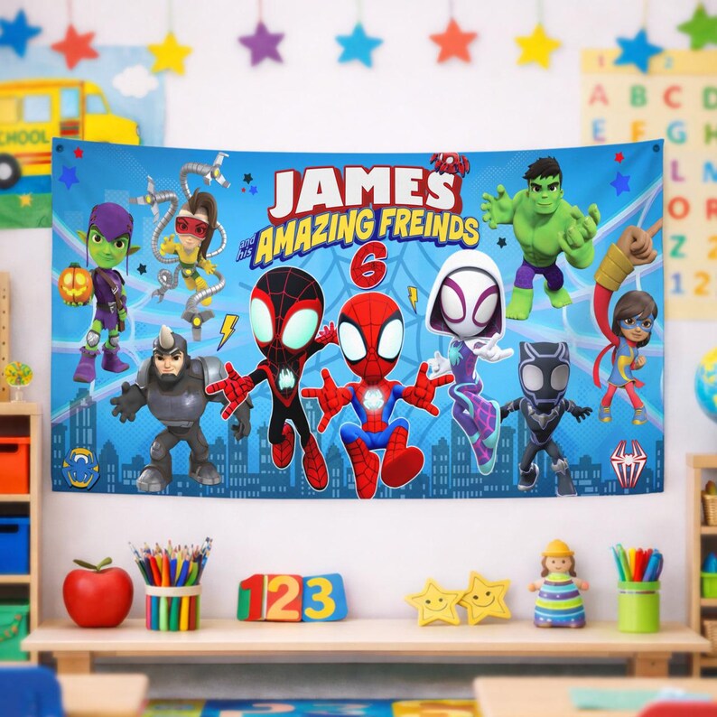 May include: A rectangular blue fabric banner featuring the text "JAMES and his AMAZING FREINDS" with a large red number 6. The design includes cartoon illustrations of various superheroes, including Spider-Man, Ghost-Spider, and the Hulk.