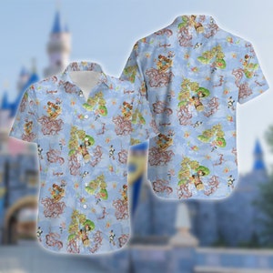 May include: A blue short-sleeved button-down shirt with a cartoon print of characters from a popular animated film. The print features a light blue background with a variety of colorful characters and objects.