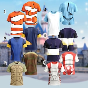 May include: A selection of six character-themed t-shirts. The shirts are short-sleeved and feature designs in various colours, including orange, blue, and white. The graphic prints resemble popular animated characters, such as fish and turtles, with cartoon-inspired elements.