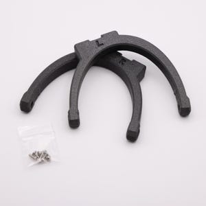 May include: Two black plastic horseshoe-shaped clamps with a small bag of screws.