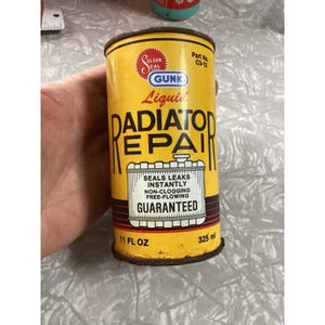 May include: A vintage GUNK Liquid Radiator Repair can with a yellow label and black text. The can reads "SEALS LEAKS INSTANTLY" and "GUARANTEED". It contains 11 fl oz.