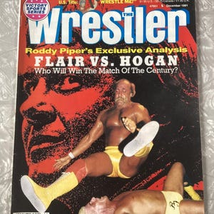 May include: The Wrestler magazine cover featuring a wrestling match between Ric Flair and Hulk Hogan. The cover features a photo of Hulk Hogan kicking Ric Flair in the face. The cover text reads "Roddy Piper's Exclusive Analysis Flair vs. Hogan Who Will Win The Match Of The Century?"