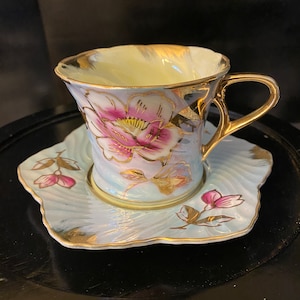 Light Blue Iridescent Teacup and Saucer with Hand Painted Flowers and Gold Accents