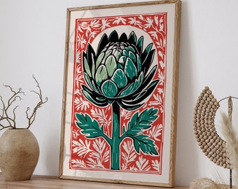May include: A framed botanical print featuring a green and black artichoke illustration on a red background with white leaf patterns. The artwork is displayed on a wooden cabinet, adding a touch of nature-inspired decor to the room.