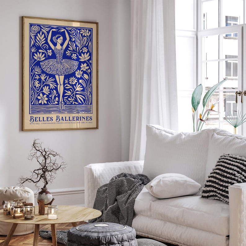 May include: A blue and white poster with a ballerina dancing in a field of flowers. The poster has the text "Belles Ballerines" at the bottom.