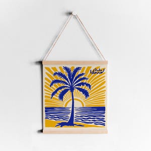 May include: A framed print of a blue palm tree with a yellow sun and ocean waves. The text 'Oahu Island' is in the upper right corner of the print.