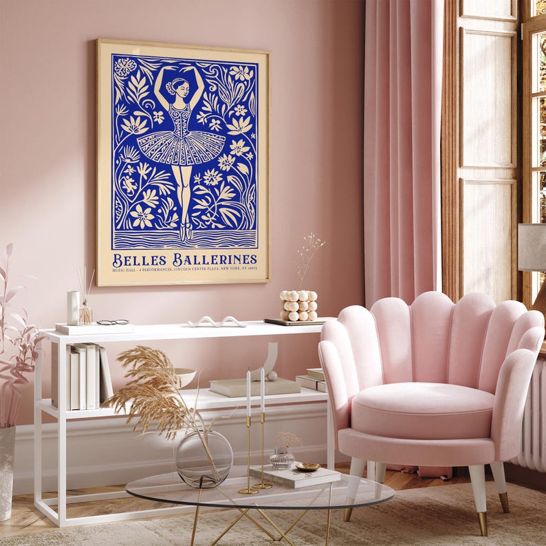 May include: A blue and white poster with a ballerina dancing in a field of flowers. The poster is framed in gold and has the text "Belles Ballerines" at the bottom.