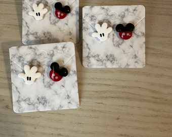 Guante de ratón y tachuelas de ratón