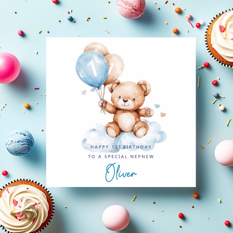 May include: A square greeting card featuring a watercolor illustration of a brown teddy bear sitting on a blue cloud, holding a blue balloon with the number 1 and a beige balloon. Text reads: HAPPY 1ST BIRTHDAY TO A SPECIAL NEPHEW and the name Oliver.