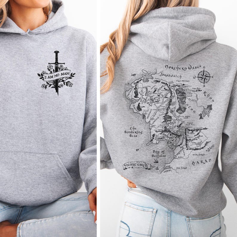 May include: A light gray hoodie with a front graphic of a sword, flowers, and the text "I AM NO MAN." The back of the hoodie features a detailed map with text and a compass rose. The hoodie has a hood and a front pocket.