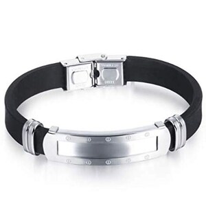 May include: A black silicone bracelet with a silver metal band and clasp. The metal band has a smooth, rectangular surface with a row of small circles around the edge.