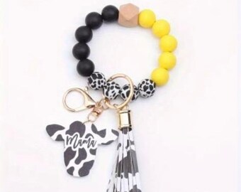 Yellow and Black Cow Print Mama Beaded Wristlet