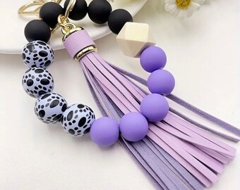 Pulsera con cuentas y estampado de perros en color lavanda y negro