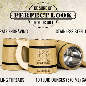 May include: Three wooden beer mugs with black bands and engraved text. The mug in the center has the text "S HXM BEST MAN 05.08.2023". The mugs have a stainless steel interior and a 19 fluid ounce (570 ml) capacity.
