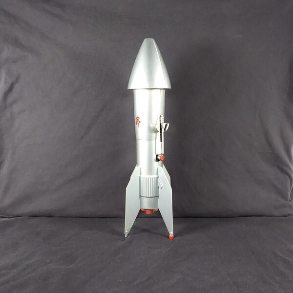 Tirelire mécanique fusée, missile guidé Astro Mfg Berzac 1957, fonctionnement