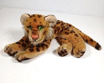 希少なシュタイフ オセロット/オゼロット、横たわる野生猫（オレンジ