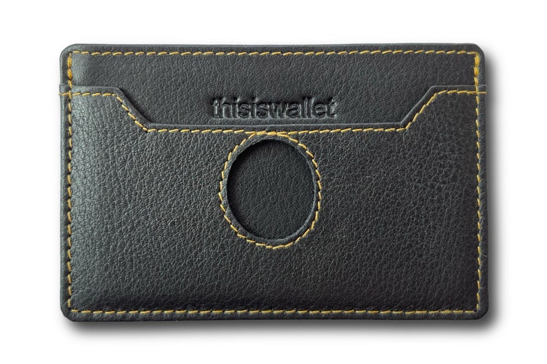 May include: Black leather wallet with a yellow stitch detail and the text "this is wallet" embossed on the front.