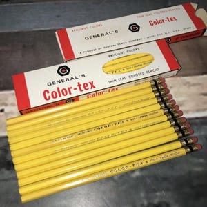 May include: A collection of yellow Color-tex pencils with red erasers, displayed with their original boxes. The boxes feature red and white accents and the text "GENERAL'S Color-tex" and "THIN LEAD COLORED PENCILS".