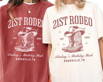May include: Crimson and ivory-colored t-shirts with a rodeo-themed graphic. The design includes the text "21st Rodeo," a cowboy hat, boots, and the text "Lindsay's Birthday Bash, Nashville, TN."