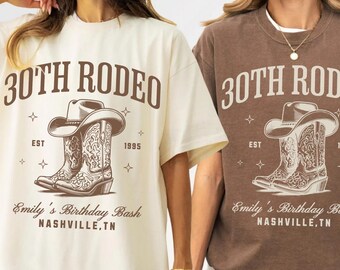 May include: Ivory and espresso-colored t-shirts with a rodeo-themed graphic. The design features a cowboy hat and boots, the text "30th Rodeo", "Emily's Birthday Bash", and "Nashville, TN".