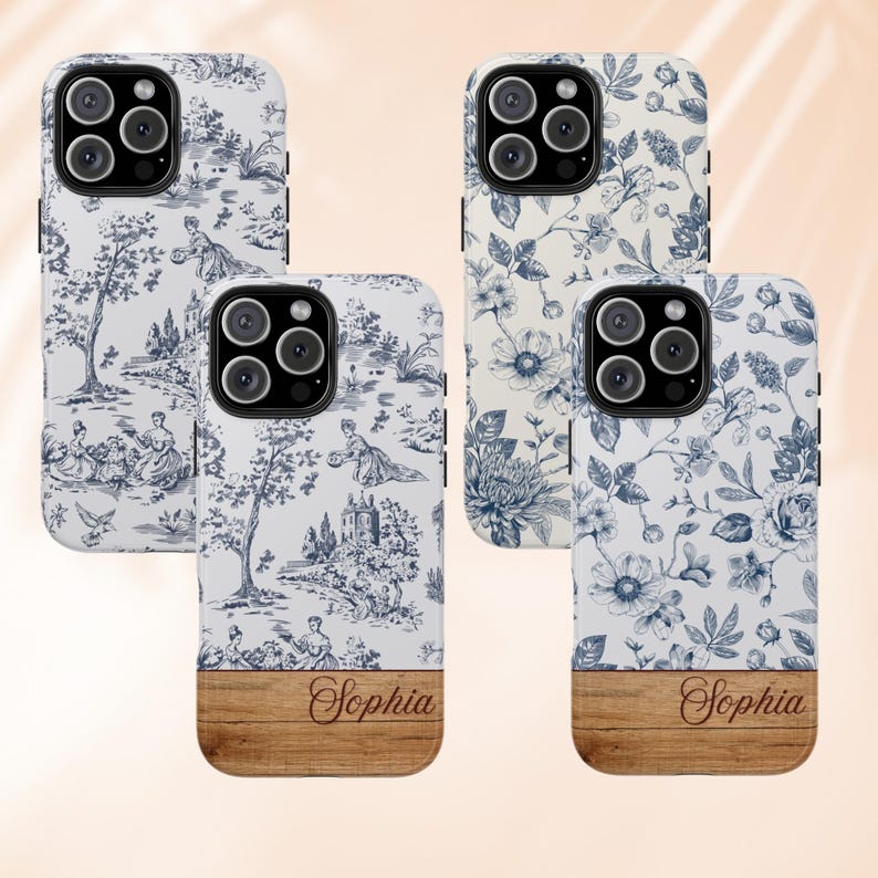 May include: Four iPhone cases with a white background and a blue floral pattern. The cases have a wood-like bottom with the name "Sophia" written in cursive.