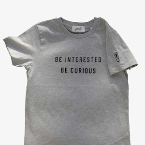 Be Interested Be Curious! Organic Cotton T-shirt for Boys and Girls with a Glow in the Dark Patch  •  Minimalist • Fairtrade  • Eco-Friendly