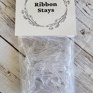 Ribbon Stays - To keep your ribbon on your spools.  Pkg of 100 clips