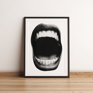 May include: A black and white photograph of a wide open mouth with teeth showing. The mouth is framed in a black frame.
