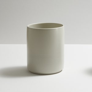 Modern handmade ceramic utensil holder. Exceptionally handcrafted. Available in white, blue grey, sage green, grey, and black.